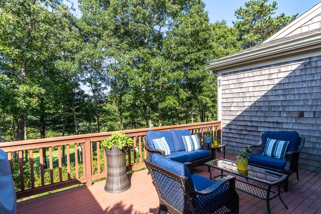 25 Rigsdale Way, Unit 25 Plymouth, MA 02360 - Photo 35 of 38 a balcony with wooden floor and outdoor seating