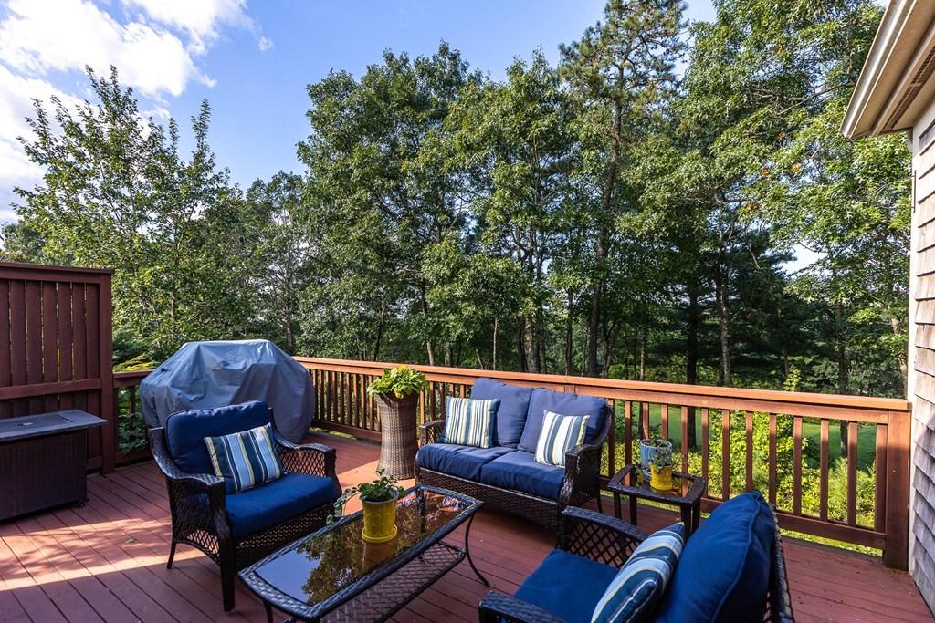 25 Rigsdale Way, Unit 25 Plymouth, MA 02360 - Photo 36 of 38 a balcony with wooden floor and outdoor seating