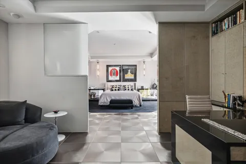 a en suite bathroom with a toilet sink and mirror