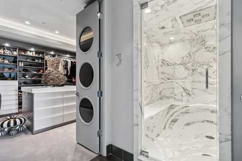 a bedroom with a bed and a television