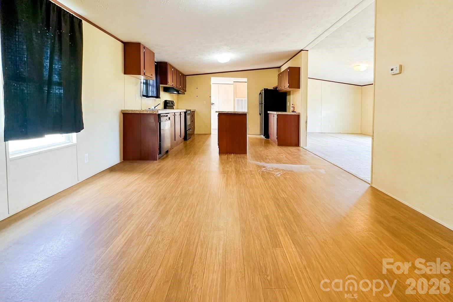 356 Brooks Road Bostic, NC 28018 - Photo 11 of 22 a view of a kitchen with a sink and a refrigerator