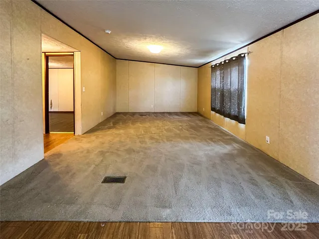 a view of hallway with livingroom