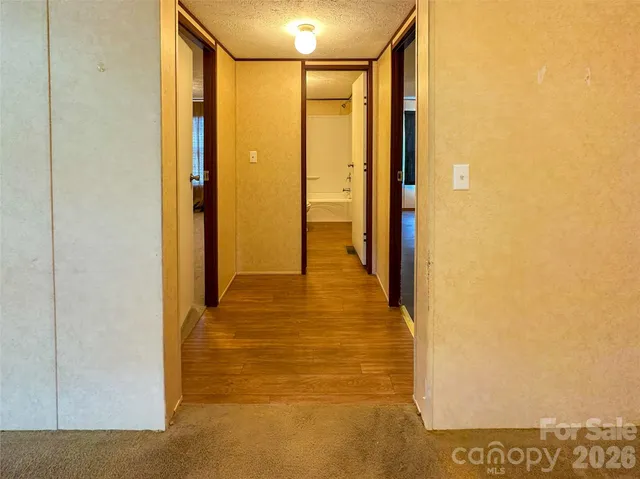 a view of hallway with livingroom