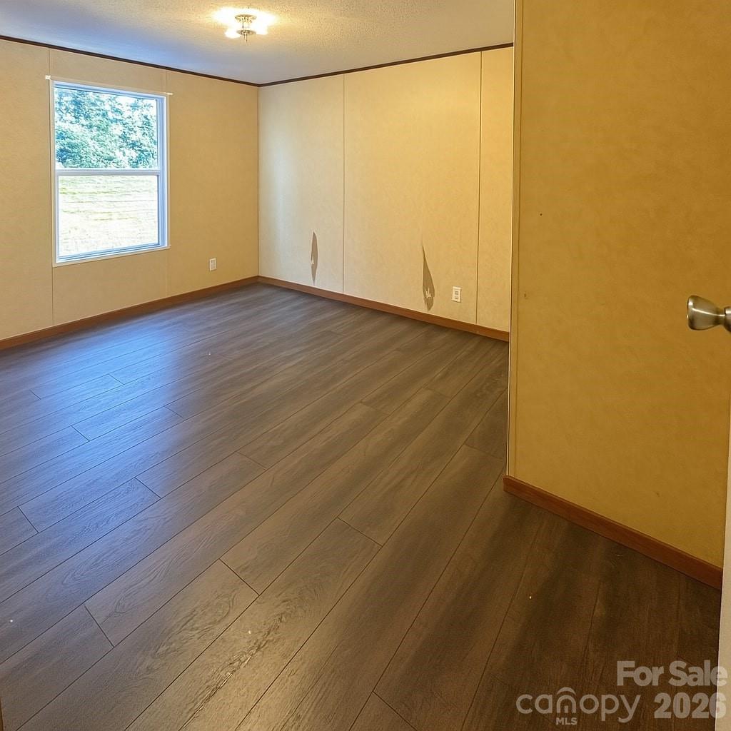 356 Brooks Road Bostic, NC 28018 - Photo 16 of 22 a view of an empty room with wooden floor and a window