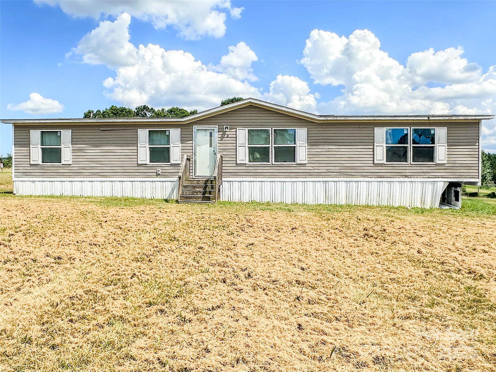 356 Brooks Road Bostic, NC 28018 - Photo 2 of 23 a front view of a house with a yard