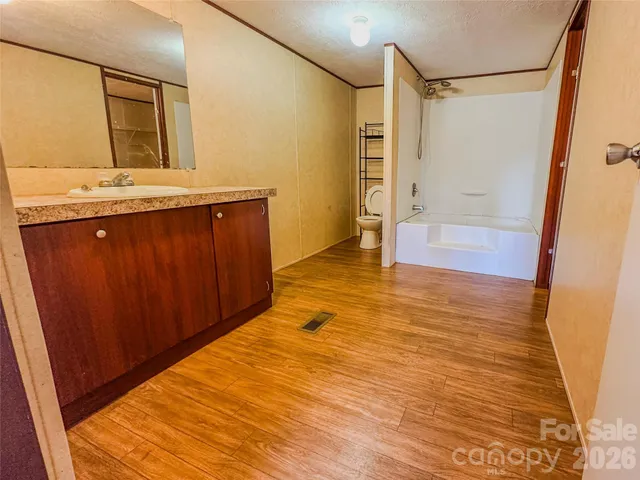 a bathroom with a bathtub and a shower
