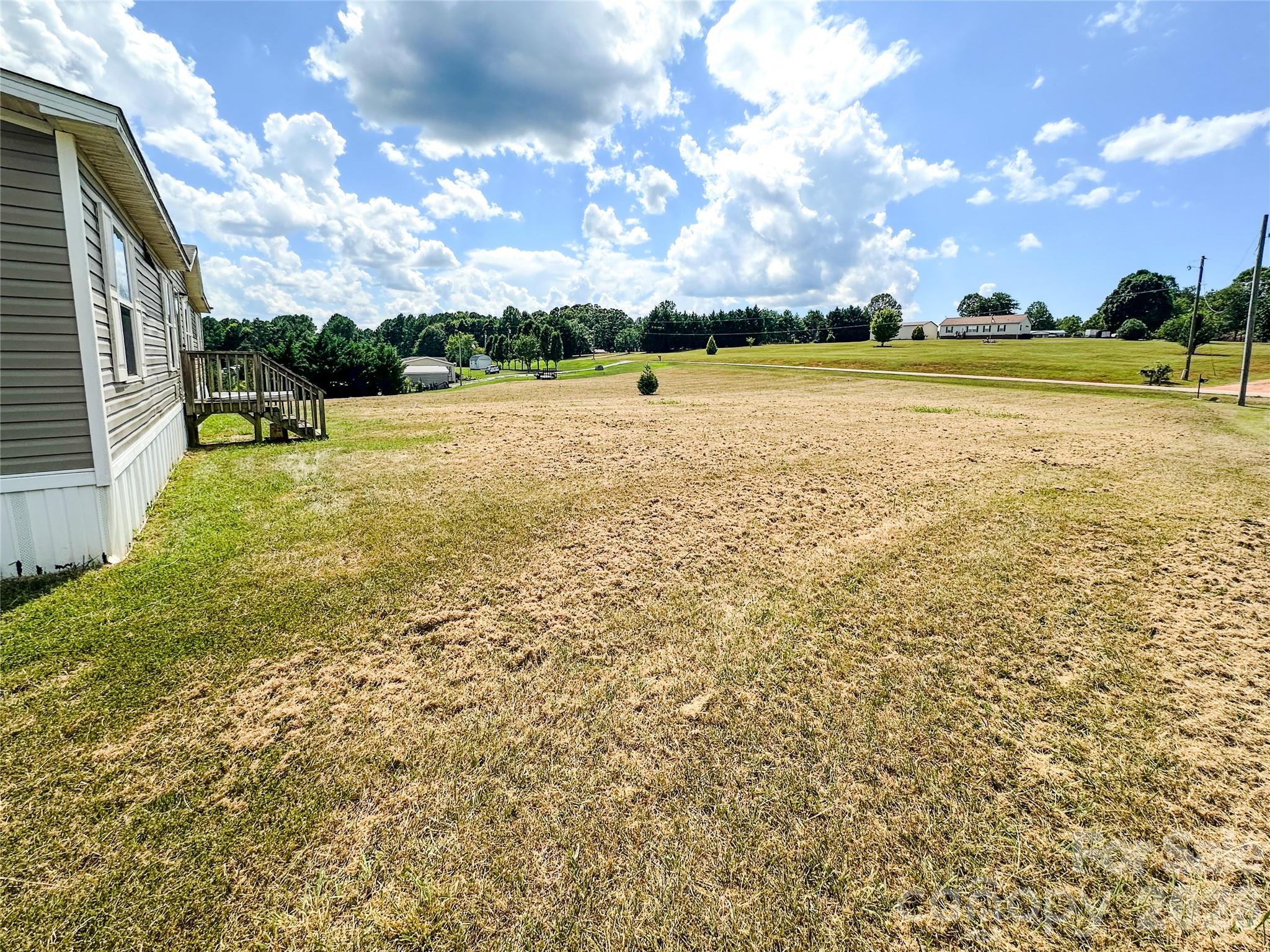 356 Brooks Road Bostic, NC 28018 - Photo 6 of 22 a view of a lake with houses in back