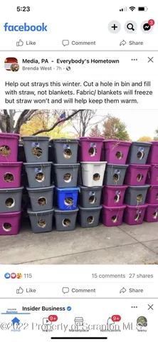 a utility room with stainless steel appliances wooden floor