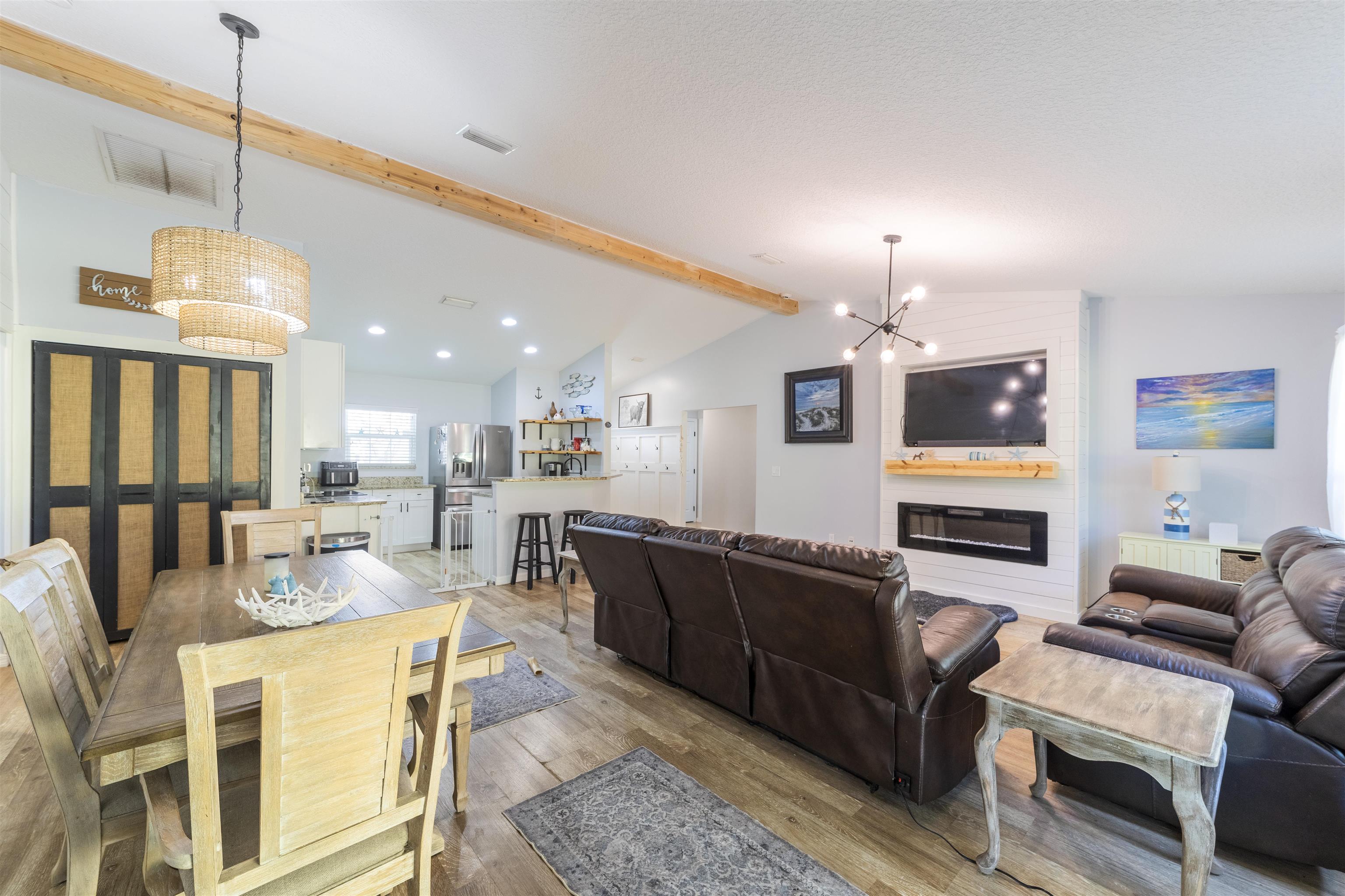 101 Azalea Road St. Augustine, FL 32086 - Photo 16 of 35 a living room with stainless steel appliances kitchen island granite countertop furniture and a view of kitchen