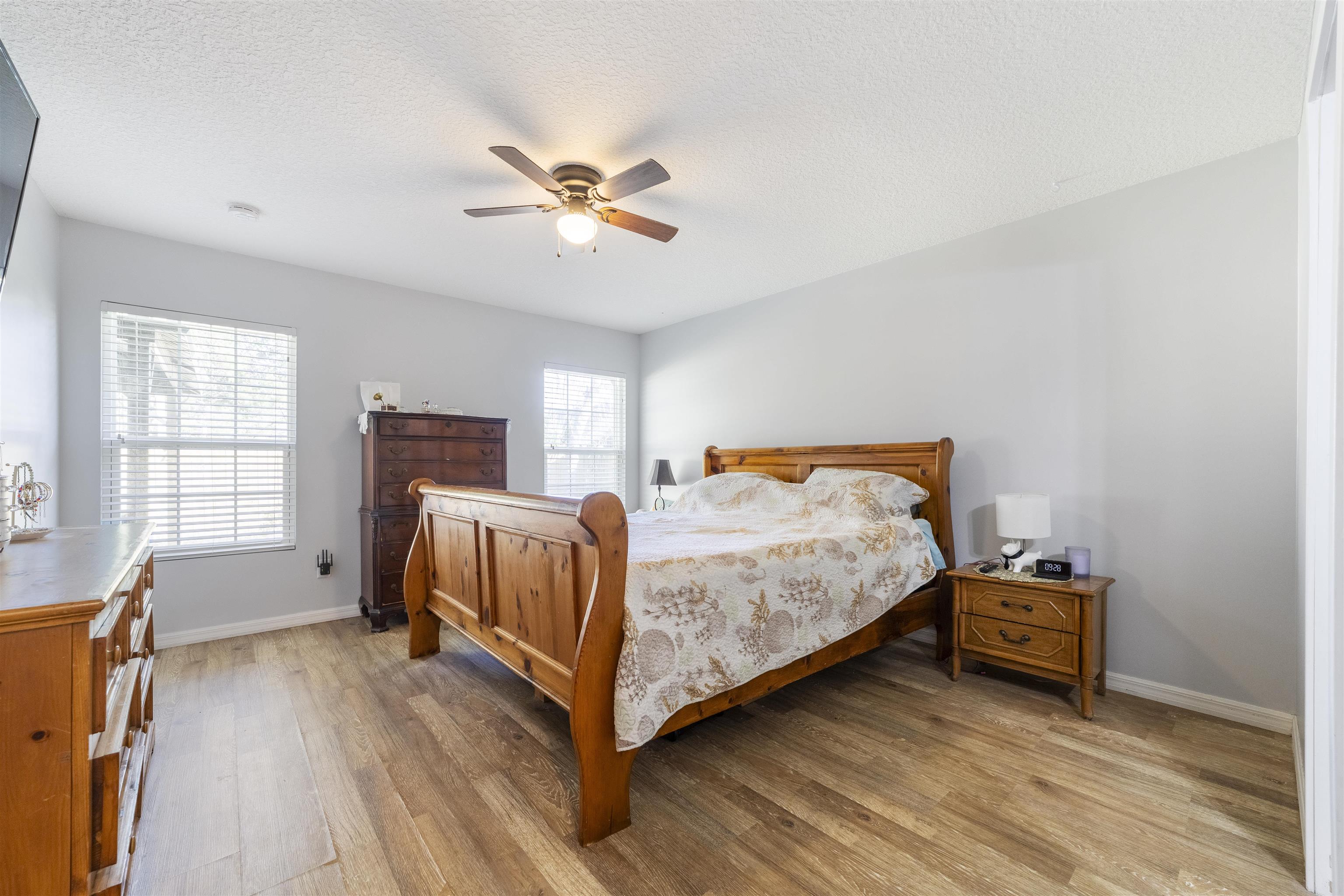 101 Azalea Road St. Augustine, FL 32086 - Photo 17 of 35 a bedroom with a bed and wooden floor