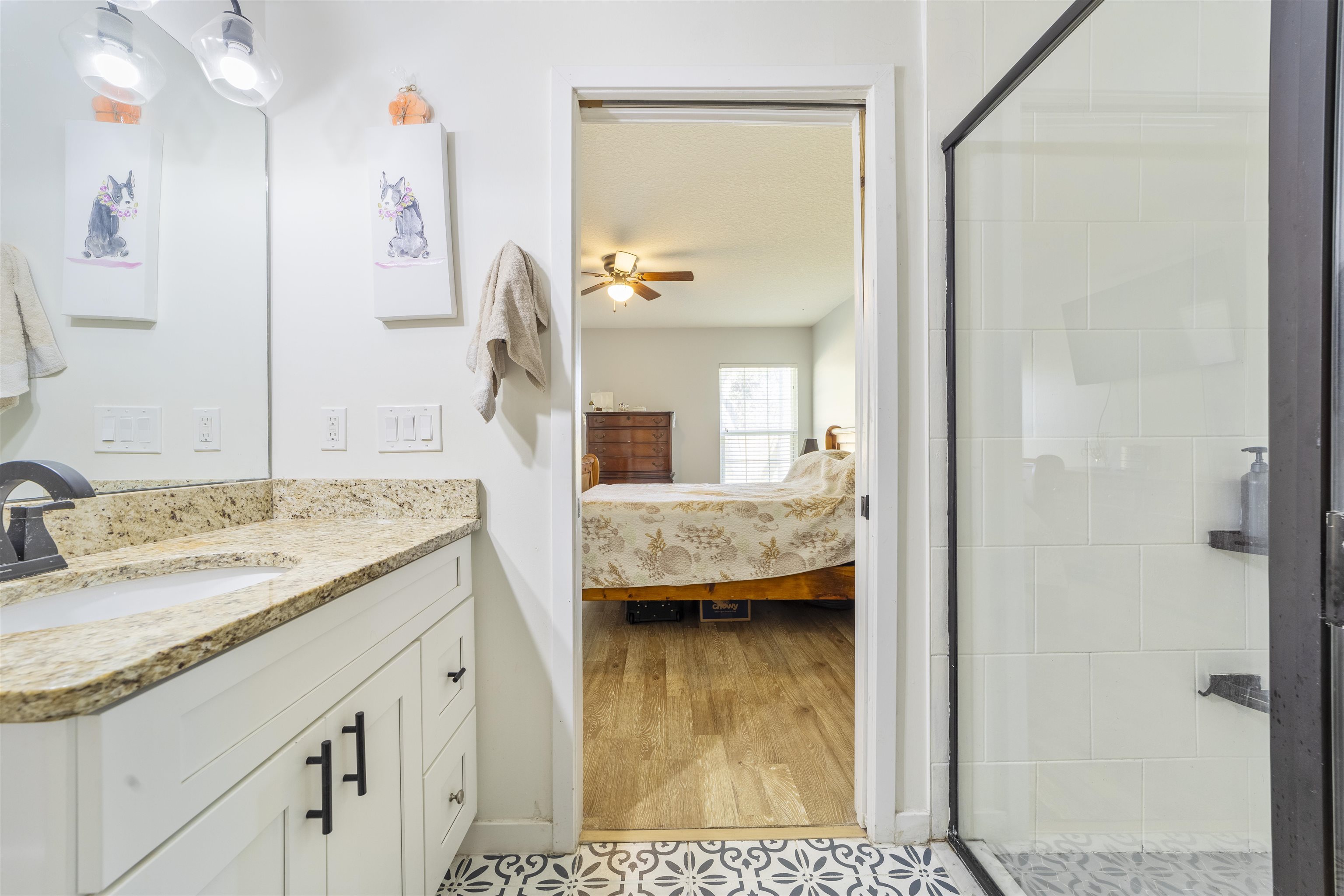 101 Azalea Road St. Augustine, FL 32086 - Photo 19 of 35 a en suite bathroom with a granite countertop sink and a mirror