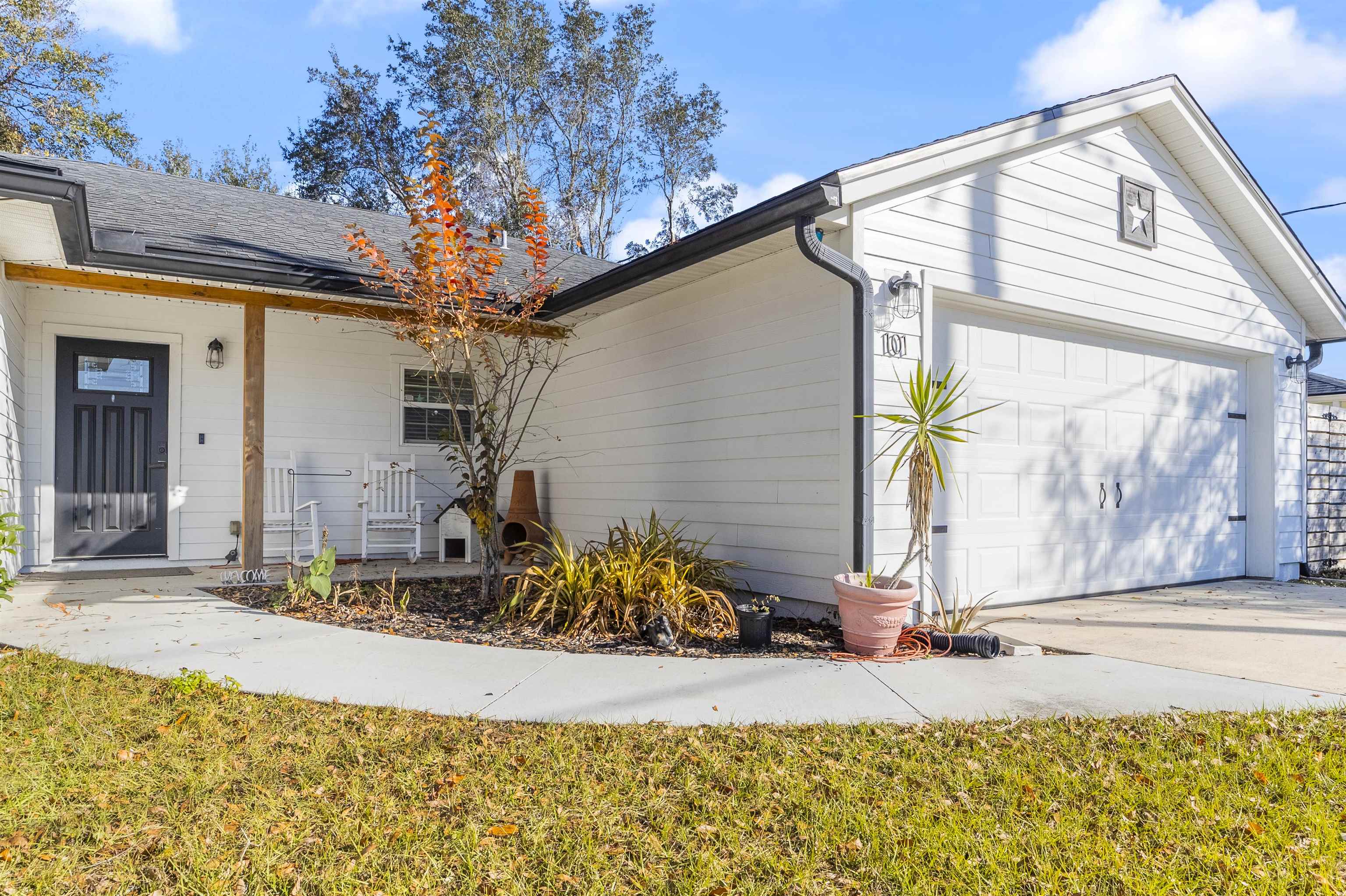 101 Azalea Road St. Augustine, FL 32086 - Photo 2 of 35 a view of a house with backyard and sitting area