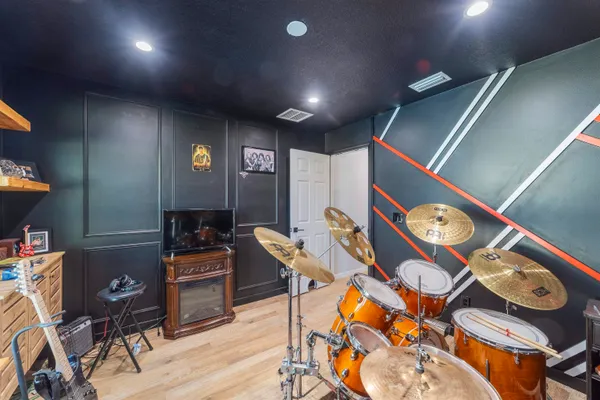 a workspace with furniture and wooden floor