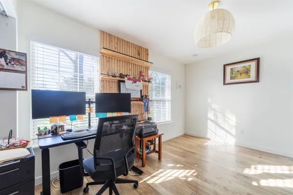 a workspace with furniture and window