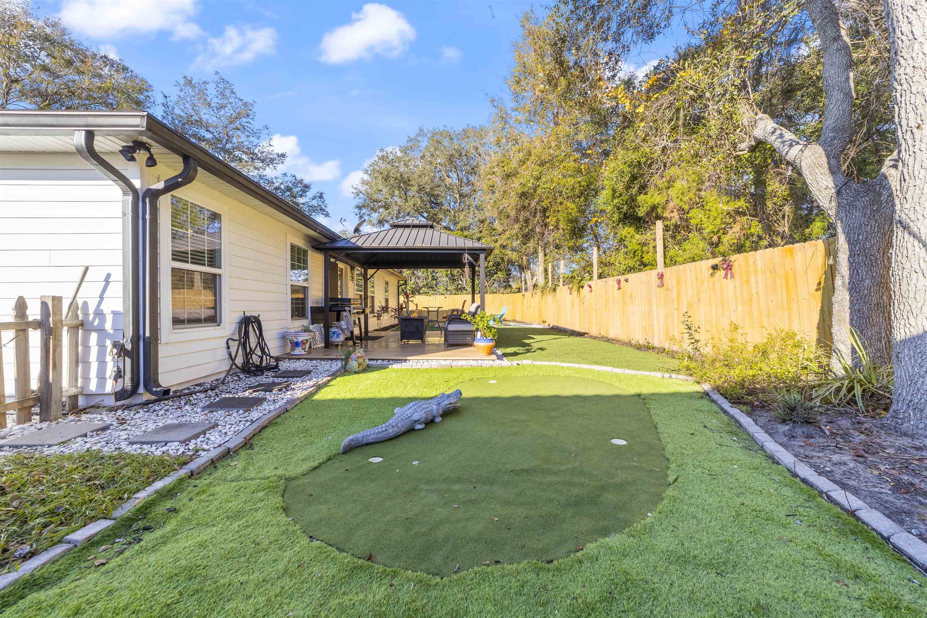 101 Azalea Road St. Augustine, FL 32086 - Photo 29 of 35 a swimming pool with outdoor seating and yard
