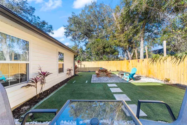 a view of a backyard with a patio