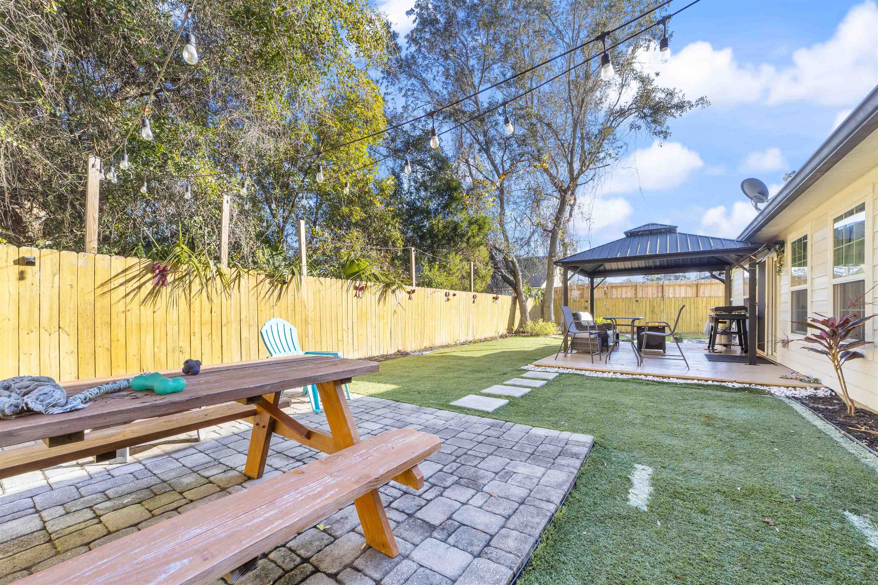 101 Azalea Road St. Augustine, FL 32086 - Photo 4 of 35 a view of a house with backyard and sitting area