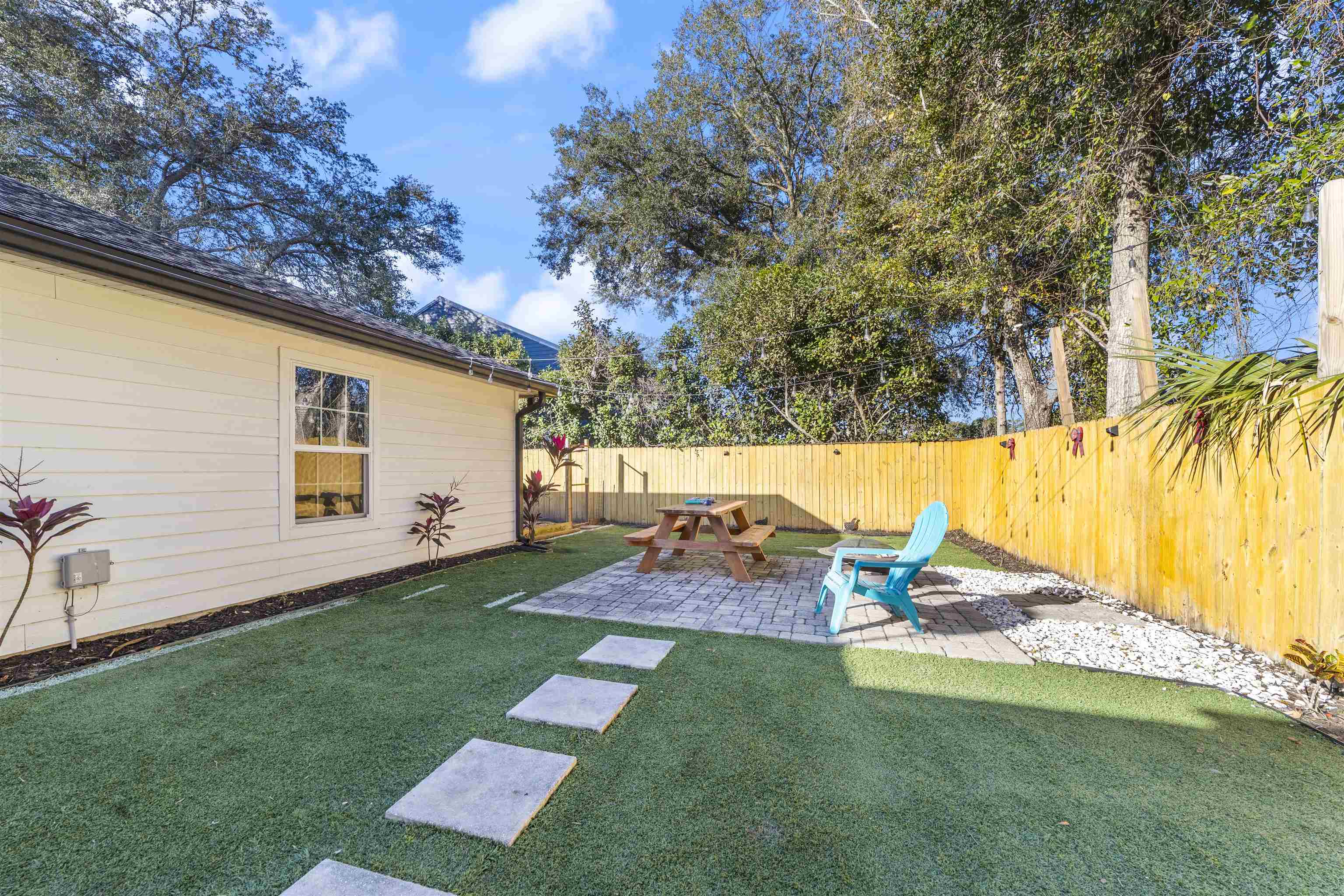 101 Azalea Road St. Augustine, FL 32086 - Photo 6 of 35 a backyard of a house with table and chairs