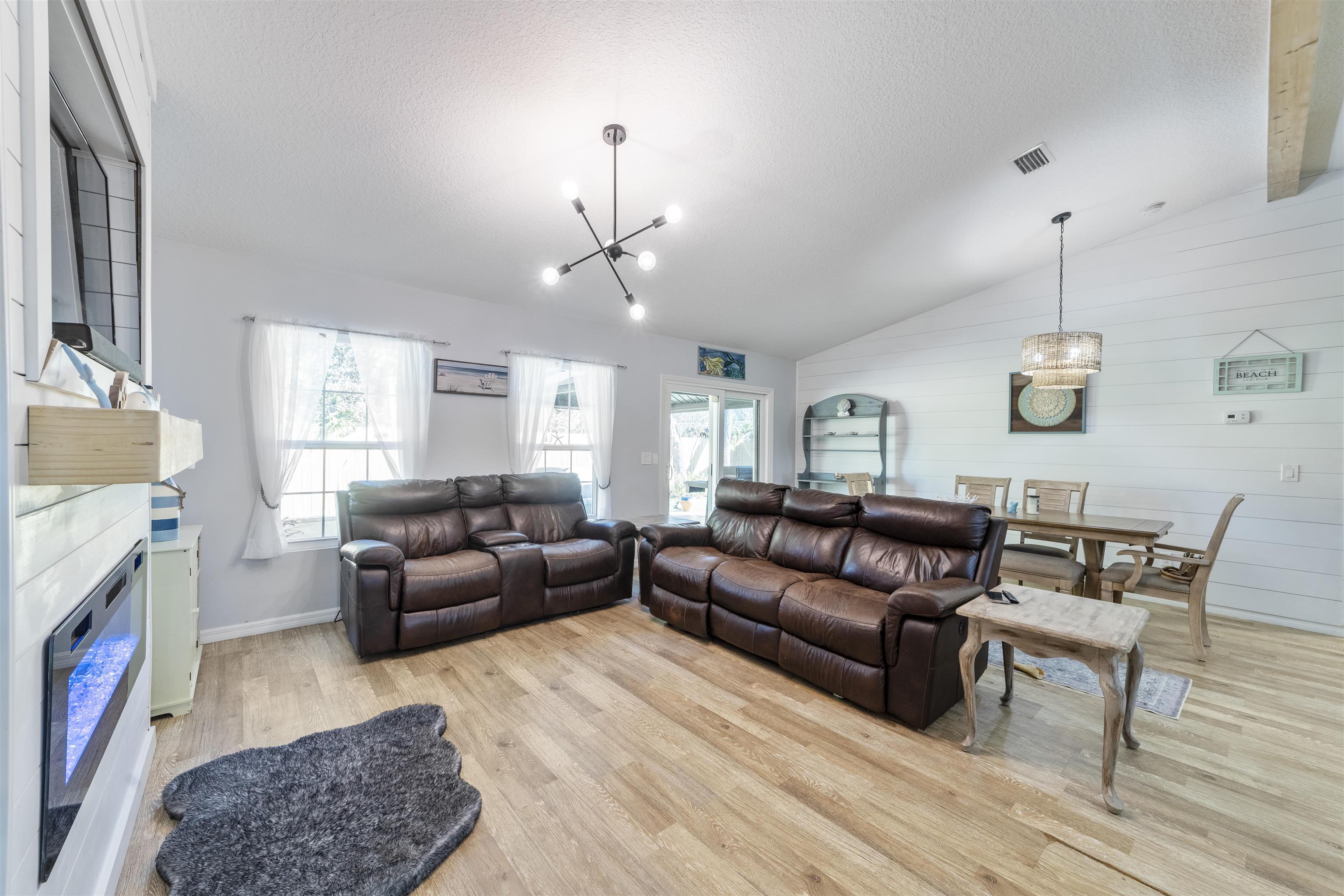 101 Azalea Road St. Augustine, FL 32086 - Photo 9 of 35 a living room with furniture and a fireplace