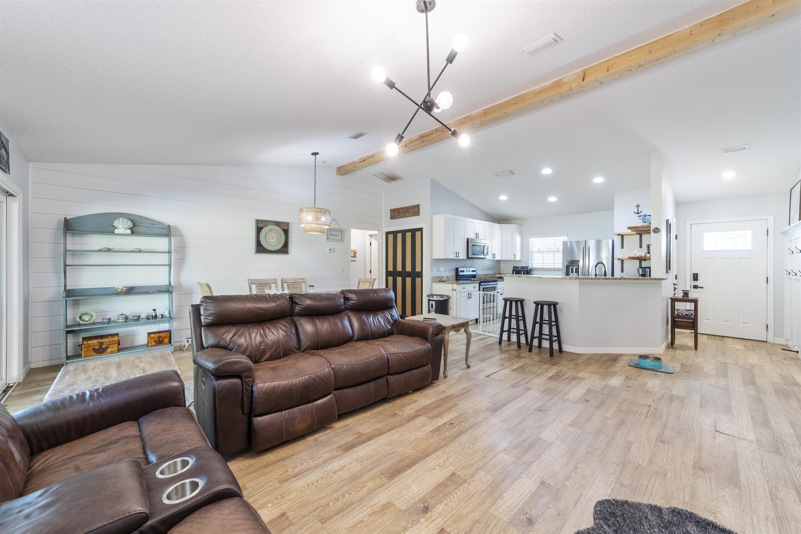 101 Azalea Road St. Augustine, FL 32086 - Photo 10 of 35 a living room with furniture and kitchen view
