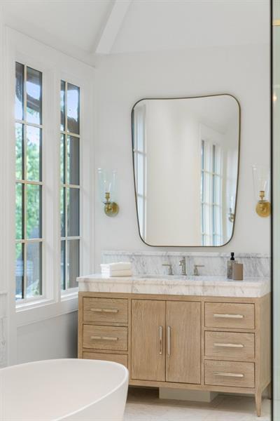 1026 Reeder Circle Northeast Atlanta, GA 30306 - Photo 38 of 95 a bathroom with a sink vanity granite tub and a mirror