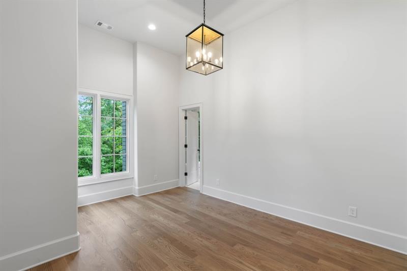 1026 Reeder Circle Northeast Atlanta, GA 30306 - Photo 51 of 95 an empty room with wooden floor and window