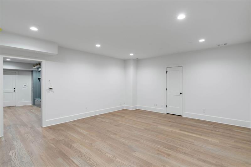 1026 Reeder Circle Northeast Atlanta, GA 30306 - Photo 59 of 95 an empty room with wooden floor and windows