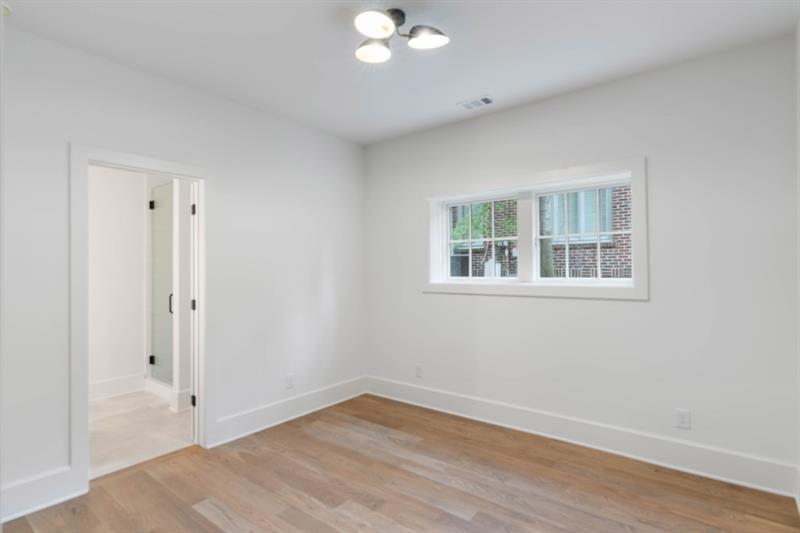 1026 Reeder Circle Northeast Atlanta, GA 30306 - Photo 61 of 95 a view of empty room with wooden floor and fan