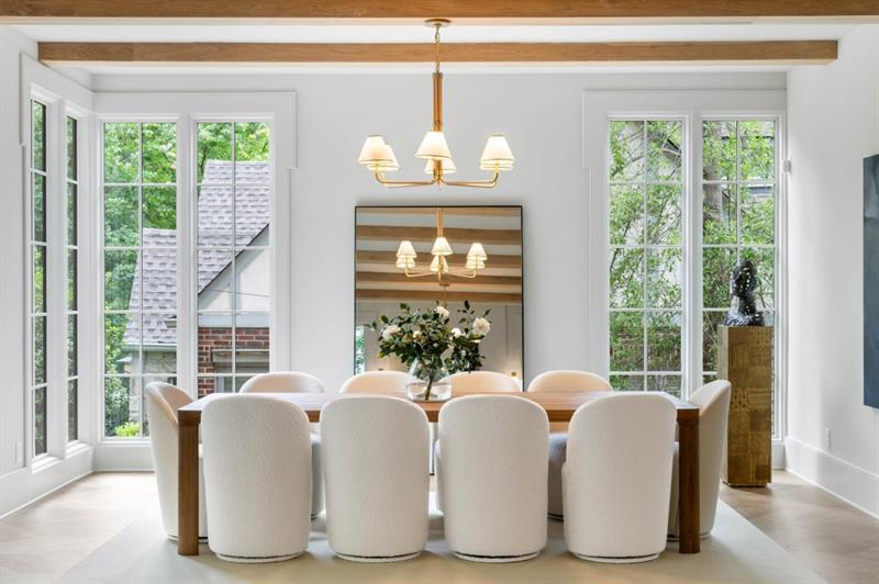 1026 Reeder Circle Northeast Atlanta, GA 30306 - Photo 10 of 95 a view of a dining room with furniture large windows and a chandelier