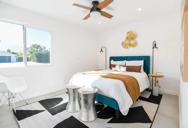 a bedroom with a bed and window