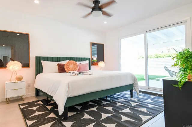 a bed room with a bed and a lamp