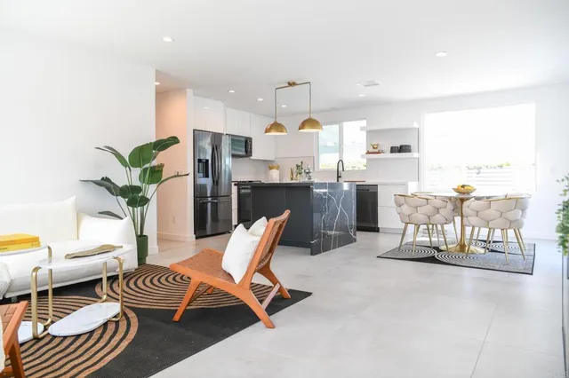 a living room with furniture and a table