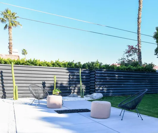 a view of a chairs and table in the patio