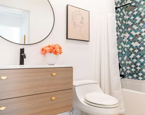 a bathroom with a toilet and a sink