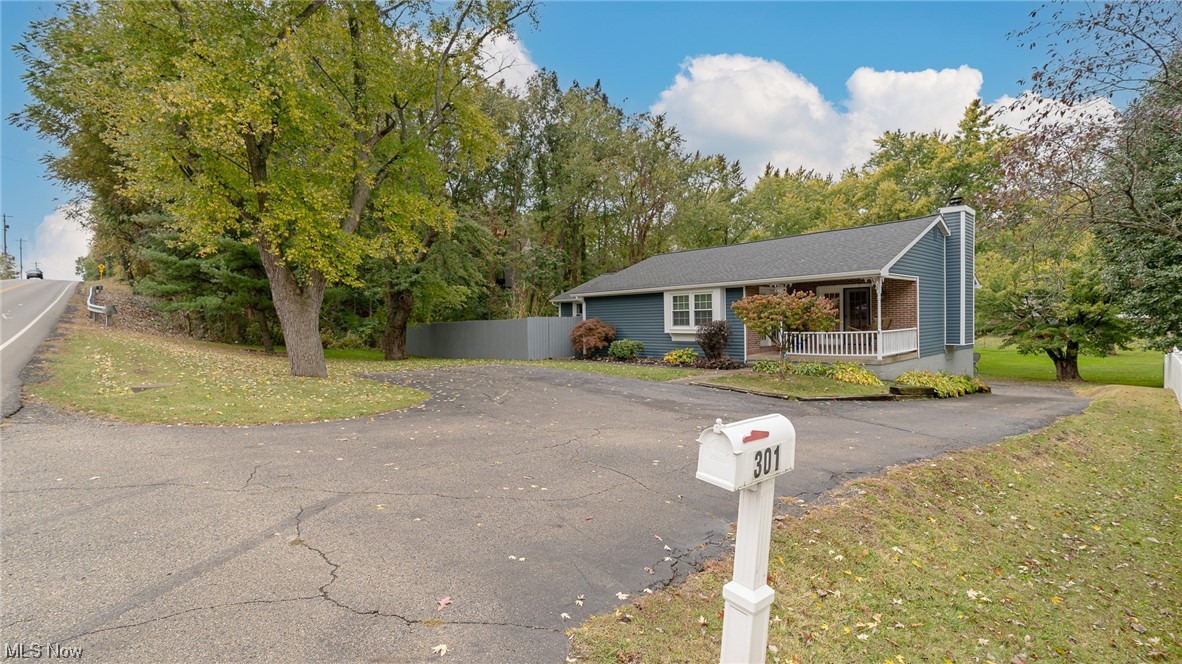 301 Perry Drive Northwest Canton, OH 44708 - Photo 2 of 34 Ranch-style home with a front porch