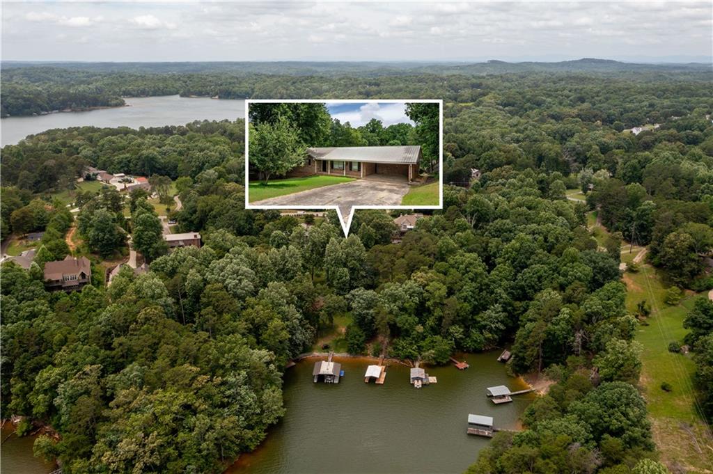 3220 Clarks Bridge Road Gainesville, GA 30506 - Photo 1 of 1 an aerial view of a house with a yard