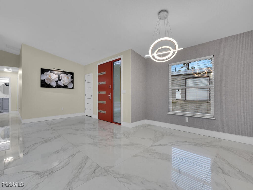 11981 Plantation Road Fort Myers, FL 33966 - Photo 14 of 48 a view of an empty room with a window