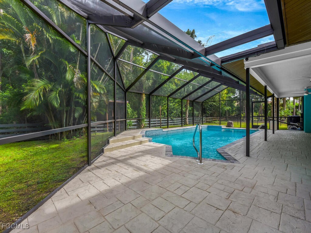 11981 Plantation Road Fort Myers, FL 33966 - Photo 33 of 48 a view of a backyard with swimming pool