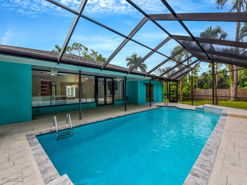 11981 Plantation Road Fort Myers, FL 33966 - Photo 35 of 48 a view of a swimming pool with a patio