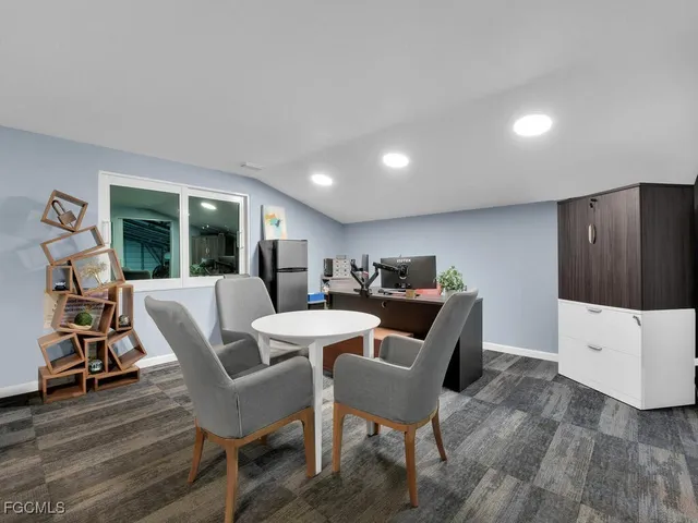 a view of a house with garage and yard