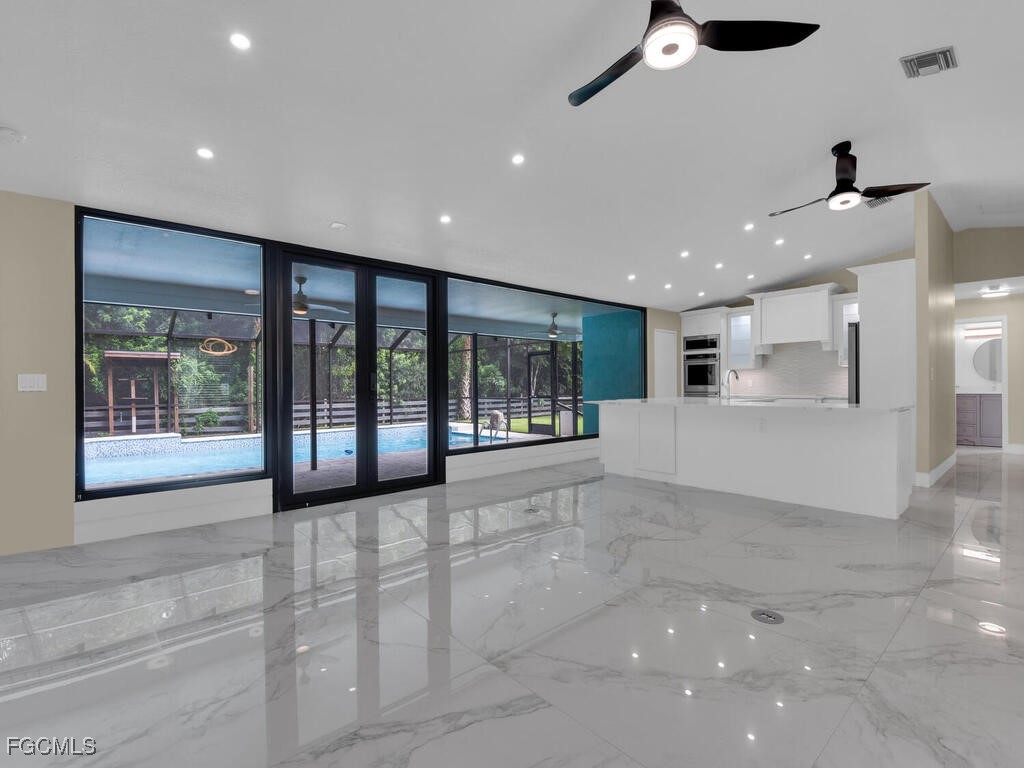 11981 Plantation Road Fort Myers, FL 33966 - Photo 7 of 48 a view of an empty room with a window