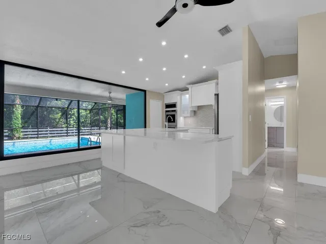 a bathroom with a large tub and shower