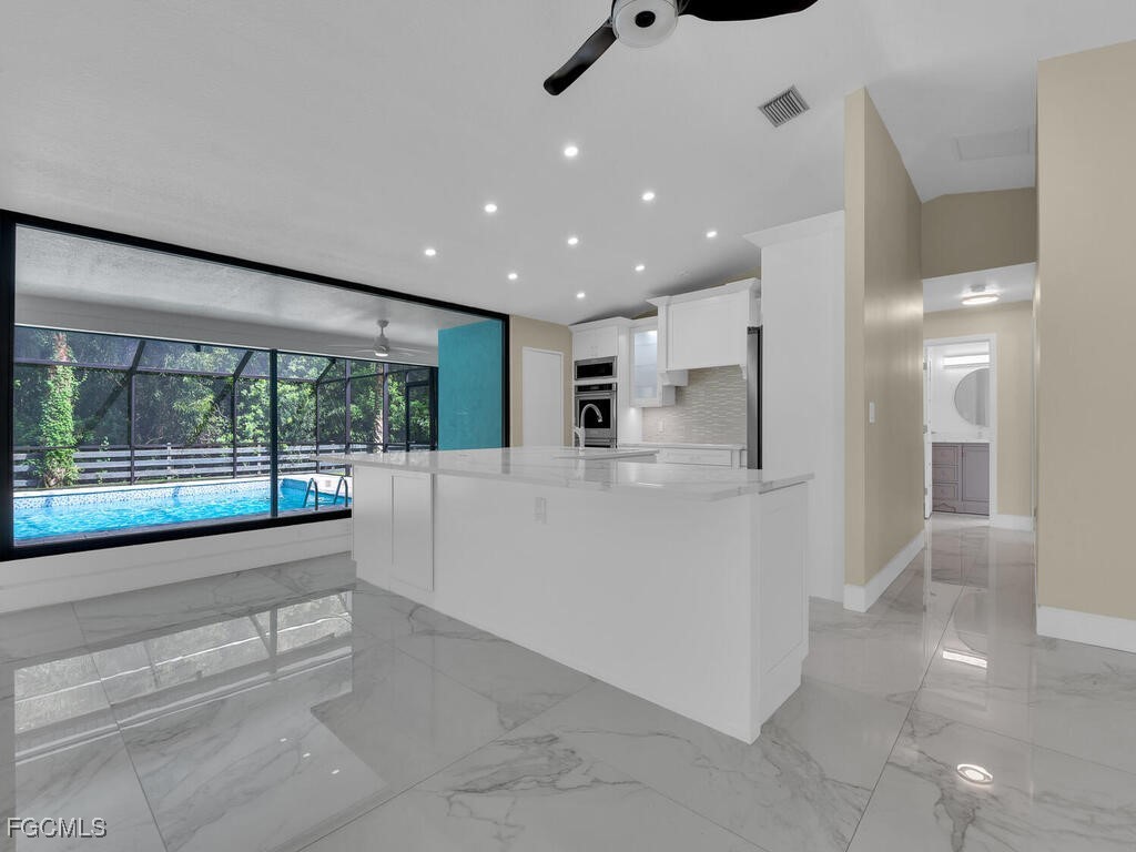 11981 Plantation Road Fort Myers, FL 33966 - Photo 8 of 48 a bathroom with a large tub and shower