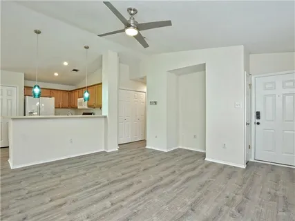 a view of a kitchen with a dishwasher and a refrigerator
