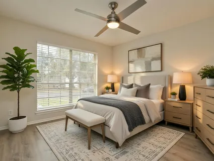 a spacious bedroom with a bed and a window