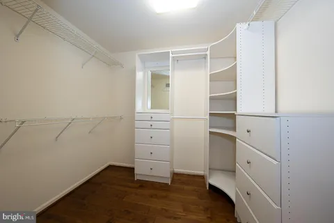 a bathroom with a shower a sink and a mirror