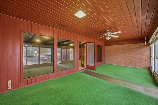 a view of an empty room with a fireplace