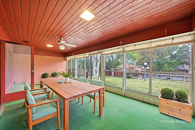 a balcony with furniture and garden view