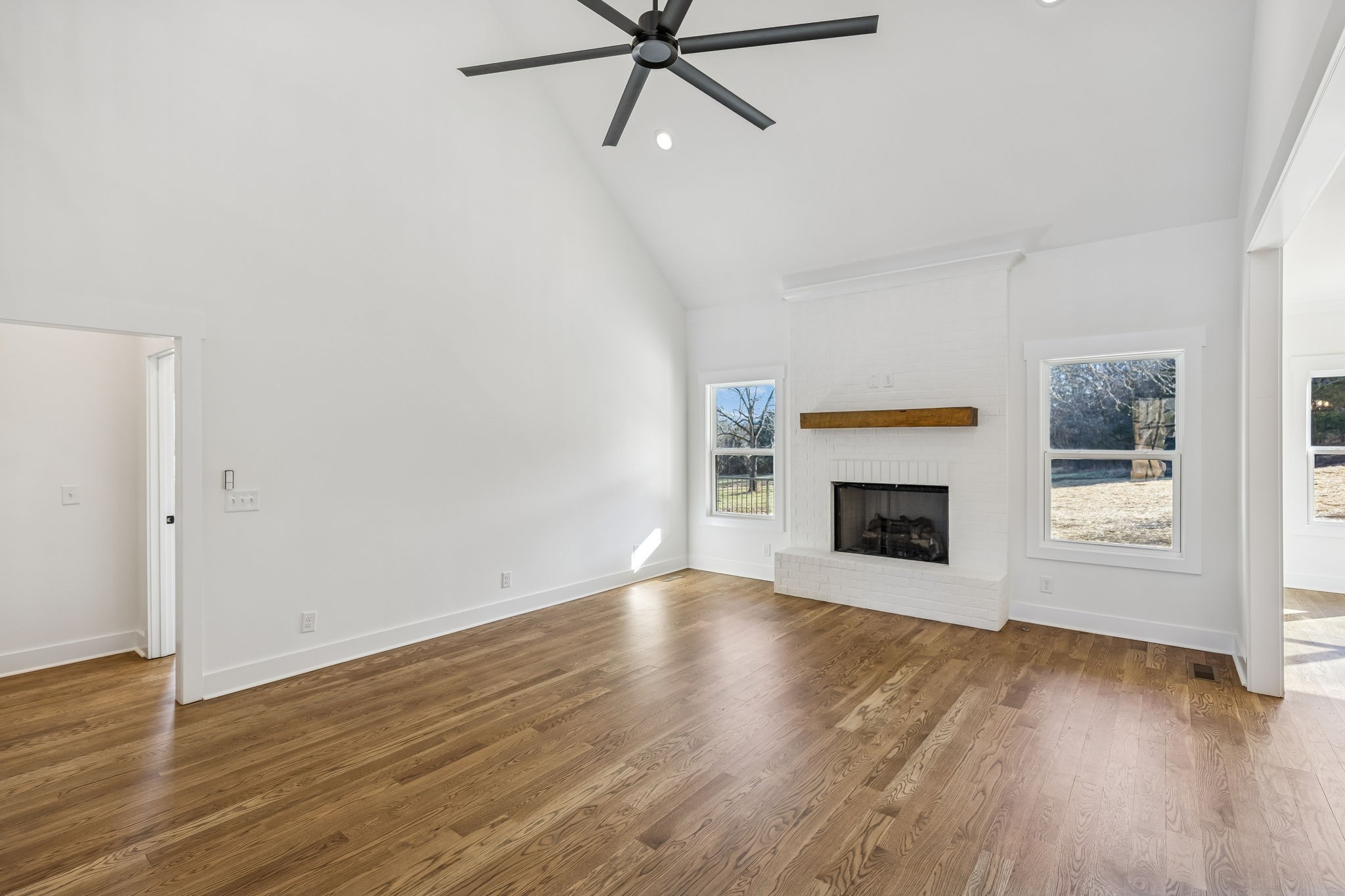 13841 Cainsville Road Lebanon, TN 37090 - Photo 14 of 81 a view of an empty room with a window and fireplace