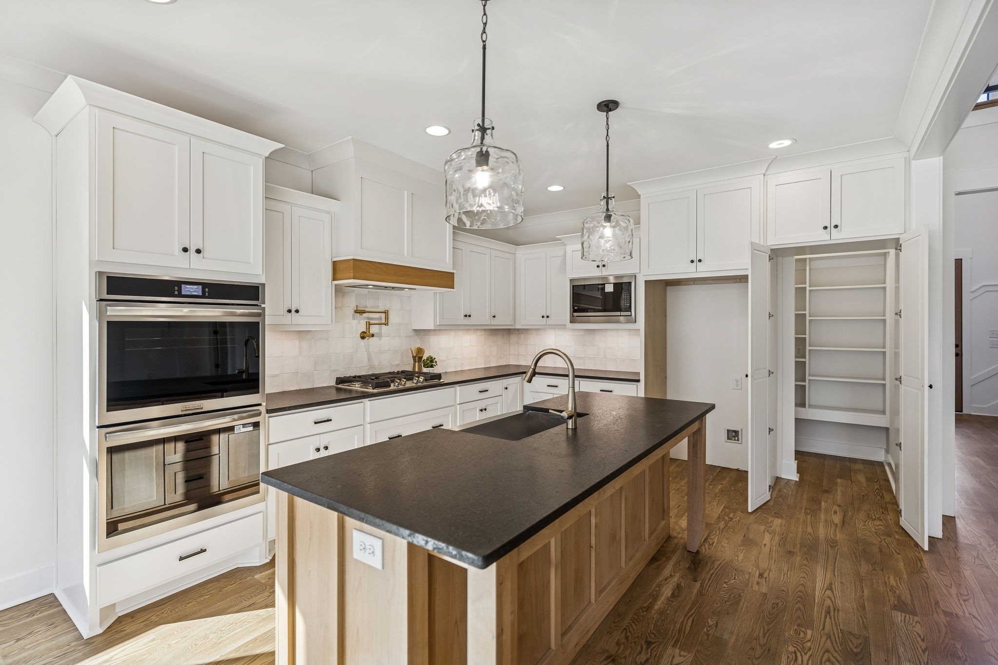 13841 Cainsville Road Lebanon, TN 37090 - Photo 19 of 81 a kitchen with kitchen island a stove sink and refrigerator